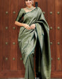 Unequalled Dark Green Soft Silk Saree With Alluring Blouse Piece
