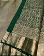 Demure Dark Green Soft Banarasi Silk Saree With Gossamer Blouse Piece