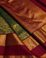 Grandiose Dark Green Pure Zari Weaving Banarasi Silk Saree With Gleaming Blouse Piece