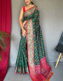 Ornate Dark Green Patola Silk Saree with Sophisticated Blouse Piece