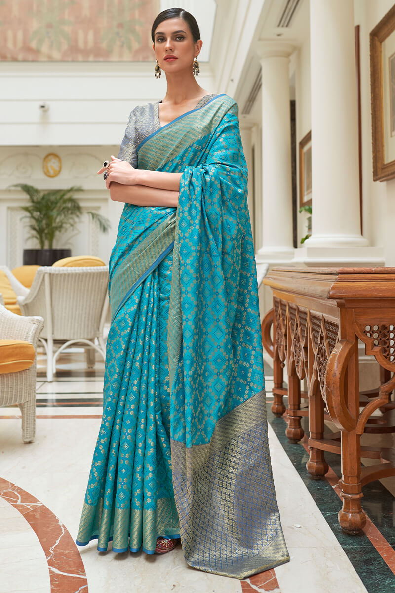 Captivating Firozi Soft Patola Silk Saree with Most Flattering Blouse Piece