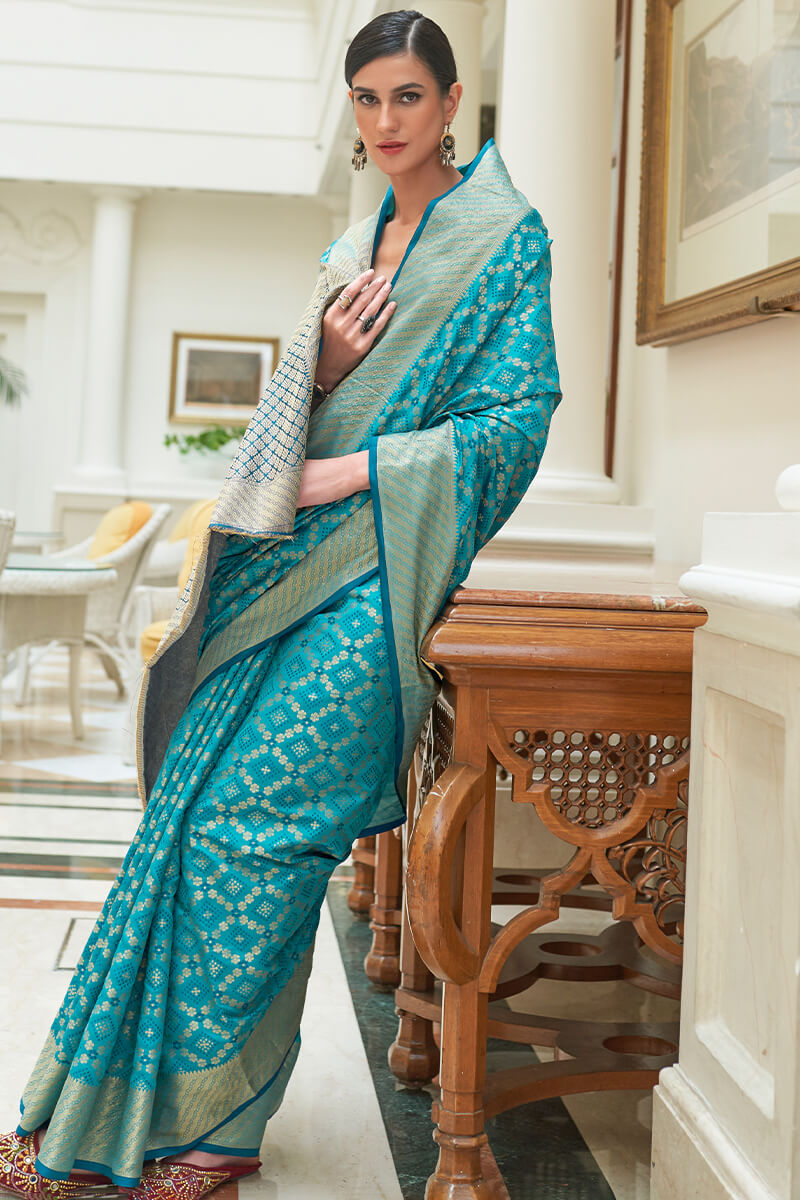 Captivating Firozi Soft Patola Silk Saree with Most Flattering Blouse Piece