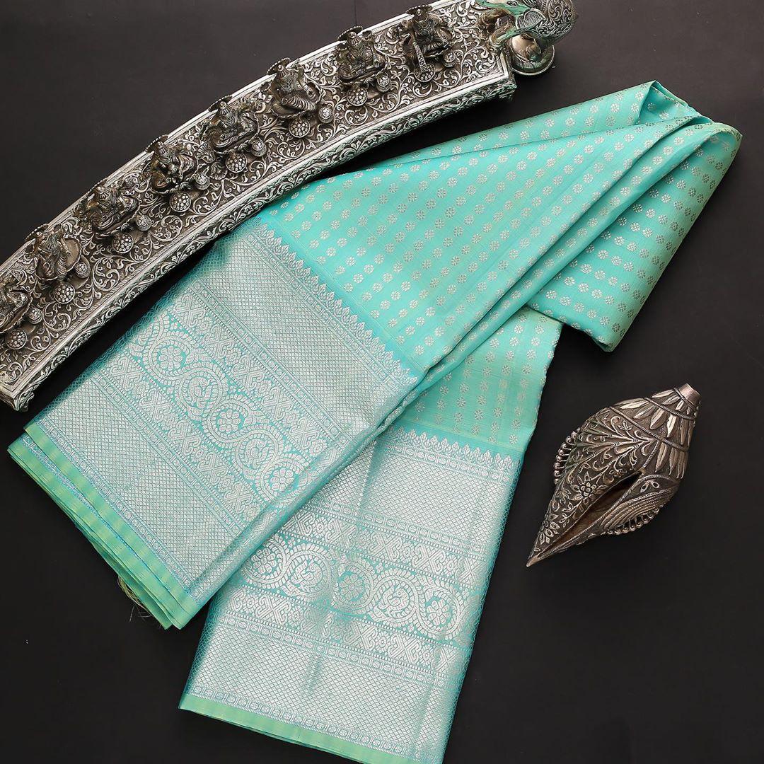 Majestic Firozi Soft Silk Saree With Enthralling Blouse Piece