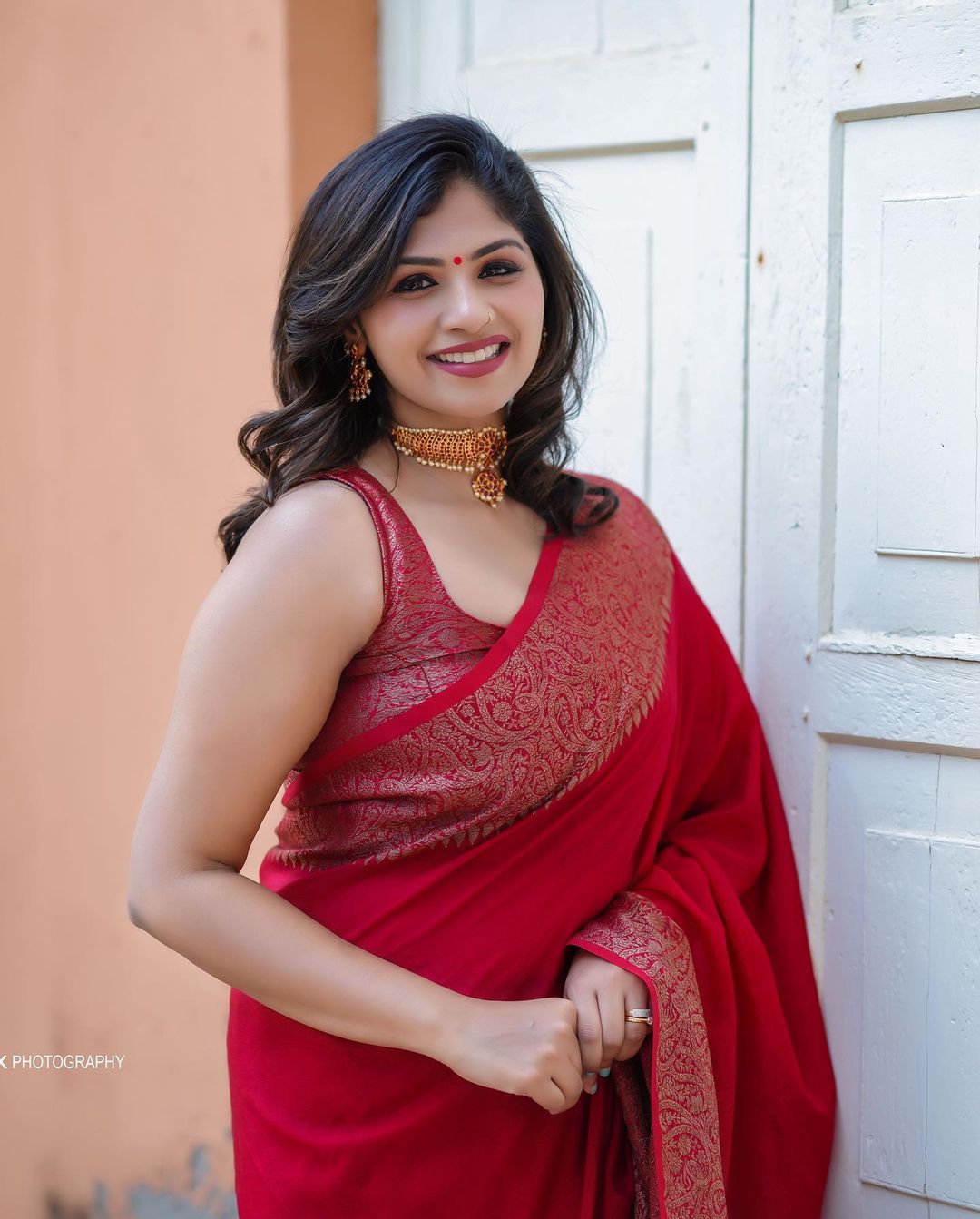 Divine Red Soft Silk Saree With Assemblage Blouse Piece