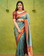 Unique Firozi Soft Banarasi Silk Saree With Exquisite Blouse Piece