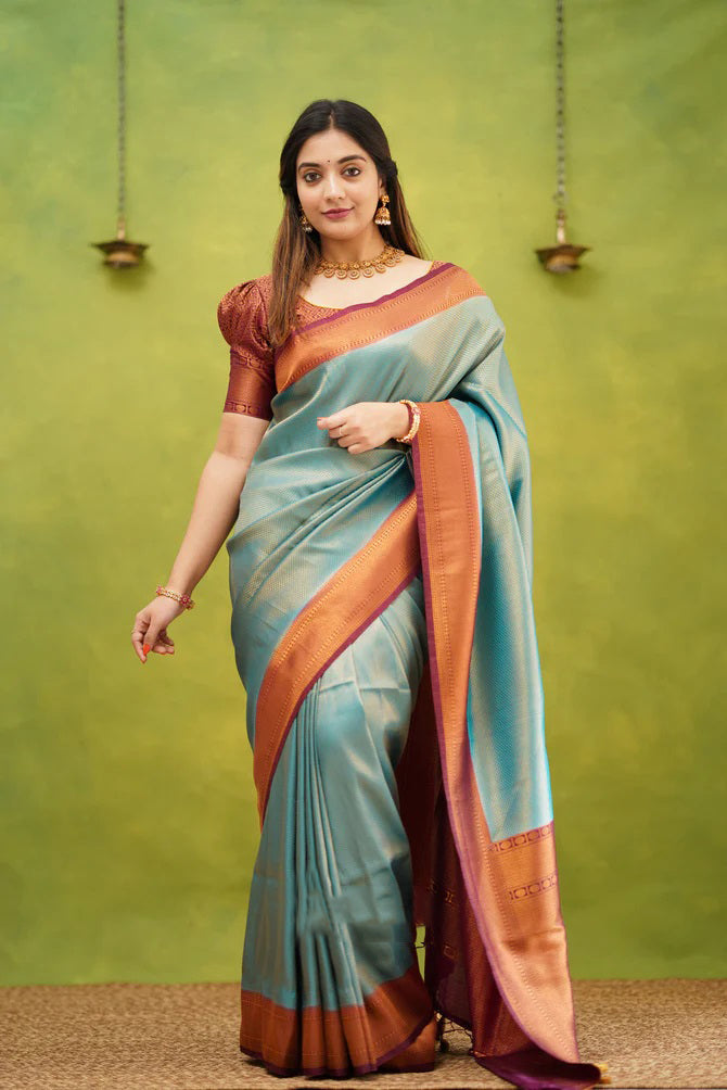 Unique Firozi Soft Banarasi Silk Saree With Exquisite Blouse Piece