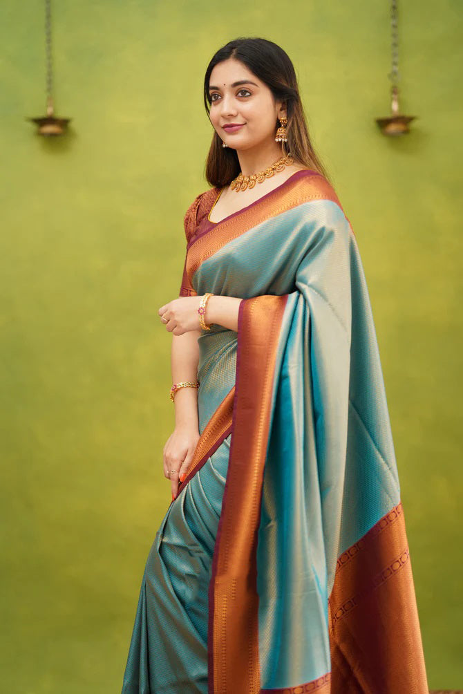 Unique Firozi Soft Banarasi Silk Saree With Exquisite Blouse Piece