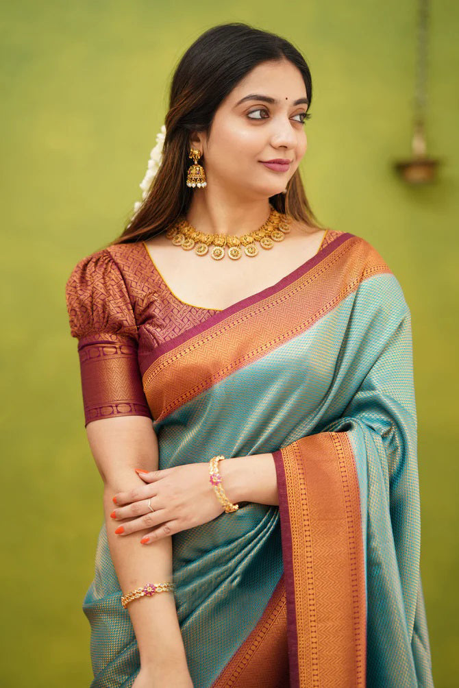 Unique Firozi Soft Banarasi Silk Saree With Exquisite Blouse Piece