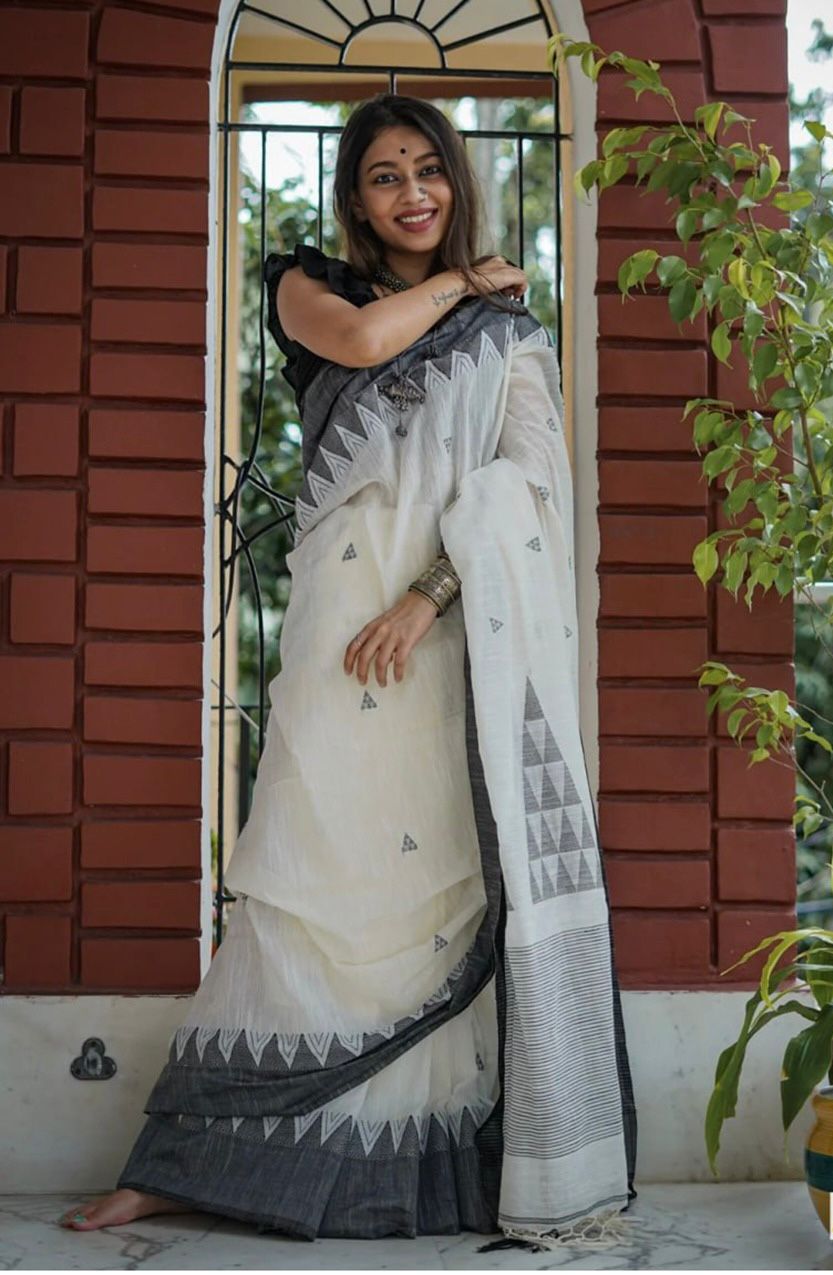 Mesmerising Off White Cotton Silk Saree With Flameboyant Blouse Piece