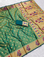 Hypnotic Green Paithani Silk Saree With Adoring Blouse Piece