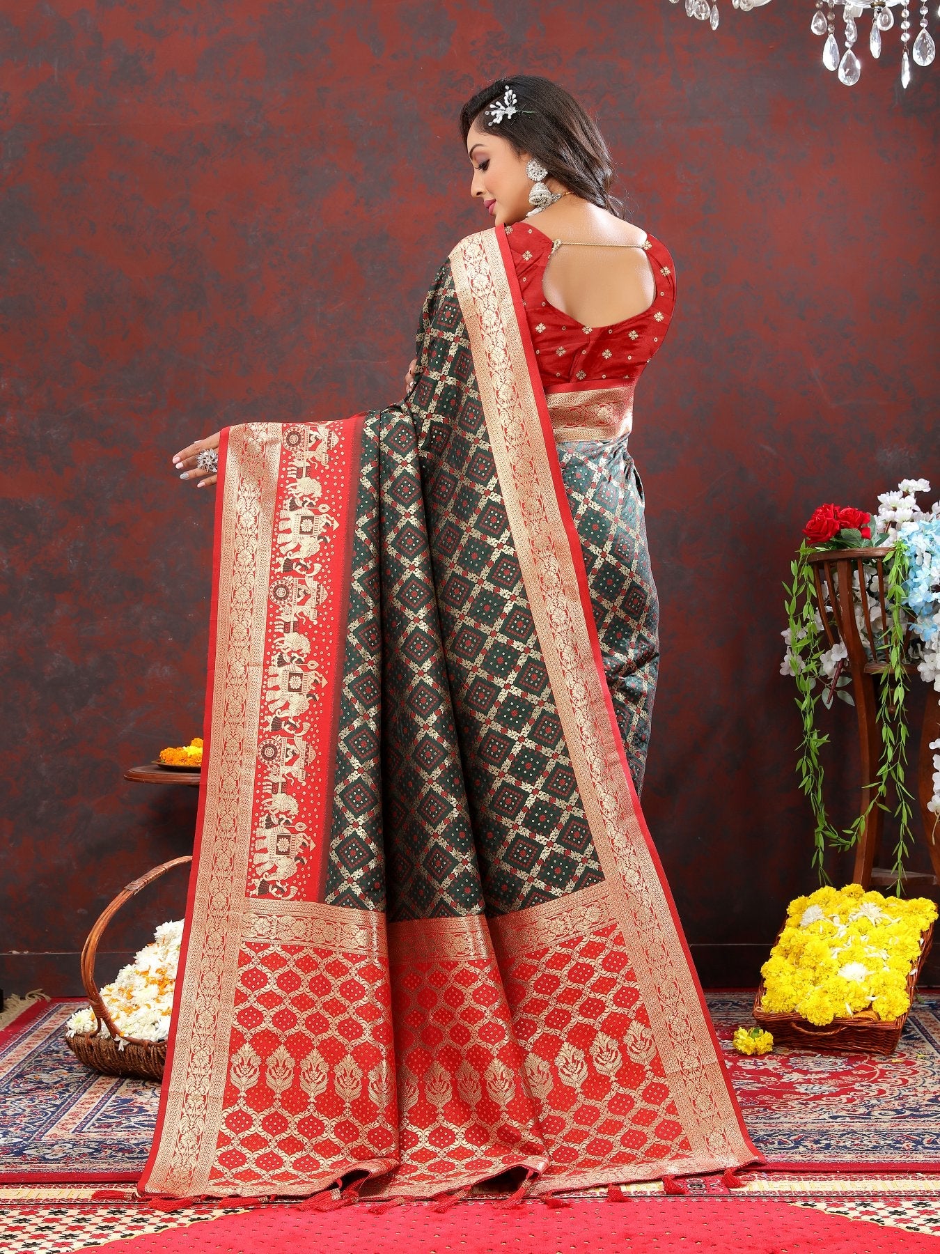 Engrossing Dark Green Patola Silk Saree with Most Stunning Blouse Piece