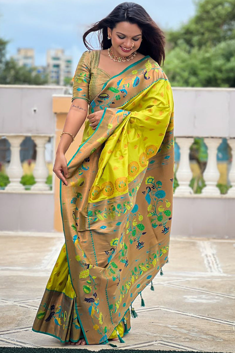 Super extravagant Parrot Paithani Silk Saree With Desirable Blouse Piece