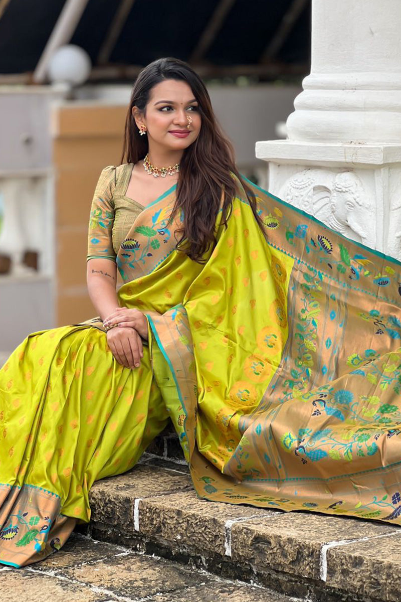 Super extravagant Parrot Paithani Silk Saree With Desirable Blouse Piece