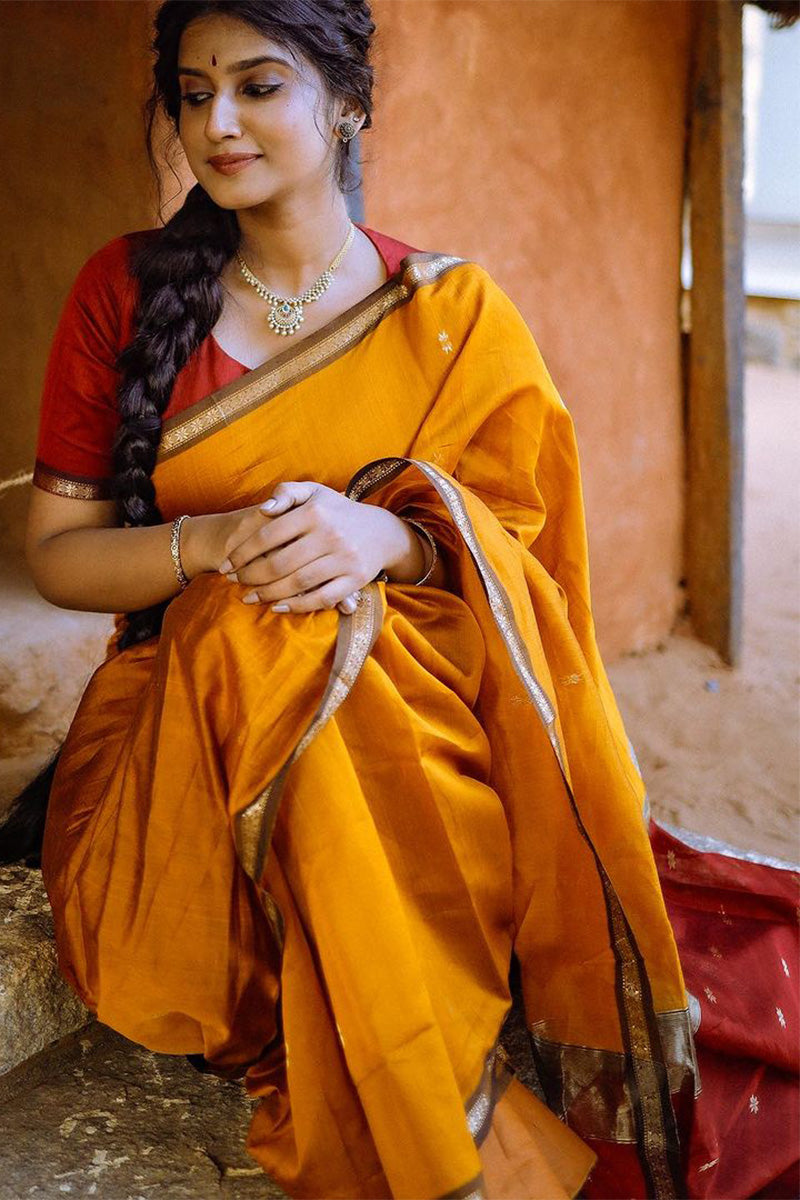 Engaging Yellow Cotton Silk Saree With Jubilant Blouse Piece