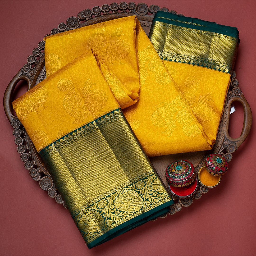 Redolent Yellow Soft Banarasi Silk Saree With Ornate Two Blouse Piece